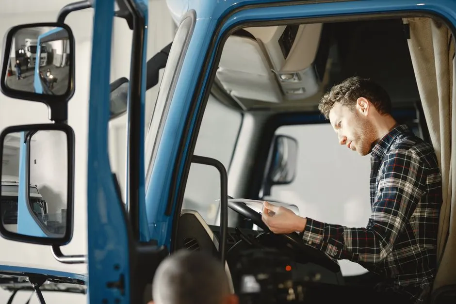 Truck driver reviewing paperwork